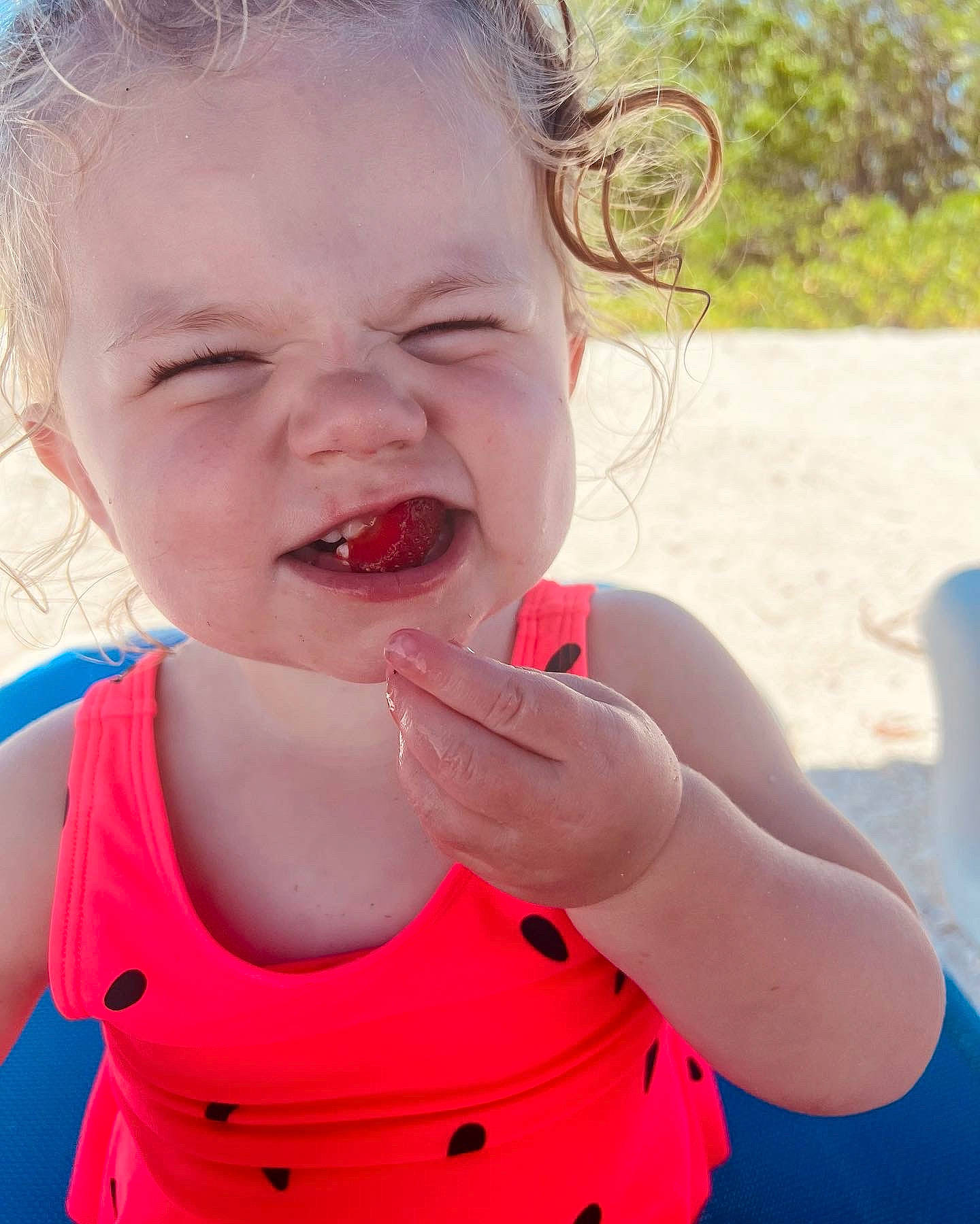 Sloane joined the competition — help win amazing prizes! baby_toddler_clothing, cheek, child, finger, fun, gesture, grass, happy, leisure, lip, magenta, mouth, neck, nose, person, pink, play, skin, smile, toddler