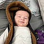 Lían Steven joined the competition — help win amazing prizes! baby, smiling, face, hood, brown, white_clothing, elephant_print, blanket, striped, bedding, soft, indoor, child, cute, portrait, cozy, warm, infant, young_child, comfort