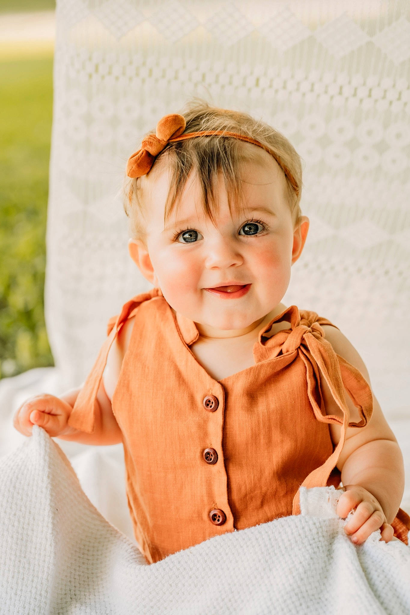 Darcy is registered to the contest to win money with this photo: baby, baby_toddler_clothing, blond, child, collar, dress, eye, fashion_accessory, happy, joy, linens, orange, outerwear, pattern, peach, person, skin, sleeve, smile, t_shirt
