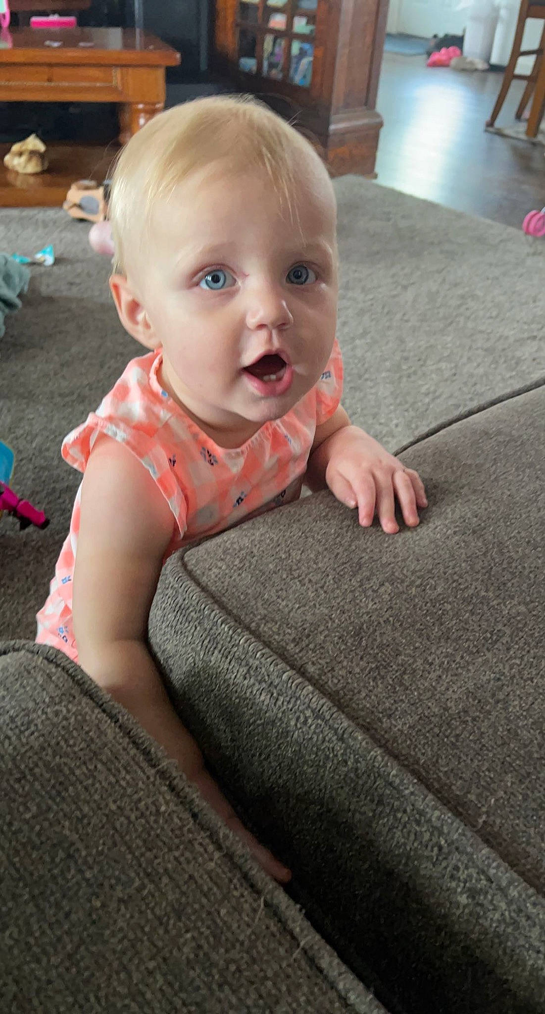 Chevelle joined the competition — help win amazing prizes! baby, baby_toddler_clothing, cheek, child, chin, comfort, facial_expression, finger, floor, flooring, hairstyle, head, iris, person, sitting, skin, sleeve, surprise, t_shirt, toddler