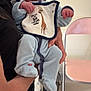 baby, child, infant, person, holding, onesie, hat, bib, giraffe, indoor, chair, arm, clothing, poster, wall, floor, pink_chair, hand, cute, newborn