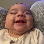 Alayah is registered to the contest to win money with this photo: baby, smiling, face, infant, onesie, bunny_print, cheeks, happy, child, portrait, closeup, sleepy, soft_lighting, cozy, cute, indoors, young_child, person, head, joyful