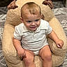 baby, child, infant, smiling, sitting, portrait, face, eyes, hair, white_shirt, collared_shirt, shorts, plush_chair, stuffed_animal, cozy, indoor, rug, home, happy, photography