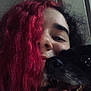 person, dog, red_hair, black_dog, close_up, tongue_out, smile, happy, indoor, portrait, face, hair, pet, animal, cute, friendship, fun, cozy, casual, warm