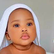Anaya joined the competition — help win amazing prizes! baby, child, towel, face, skin, eyes, lips, cute, portrait, infant, head, expression, indoors, person, young, adorable, soft, looking, closeup, chubby