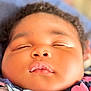 Anaya is registered to the contest to win money with this photo: baby, sleeping, face, close_up, child, peaceful, blanket, curly_hair, chubby_cheeks, soft_skin, indoors, portrait, cute, infant, relaxation, young_child, nap, sleep, calm, comfort