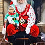 D'Andre joined the competition — help win amazing prizes! santa_claus, baby, child, elf_costume, christmas, holiday, festive, beard, red_clothing, green_clothing, boots, gloves, chair, fireplace, brick_wall, indoor, smiling, person, portrait, costume