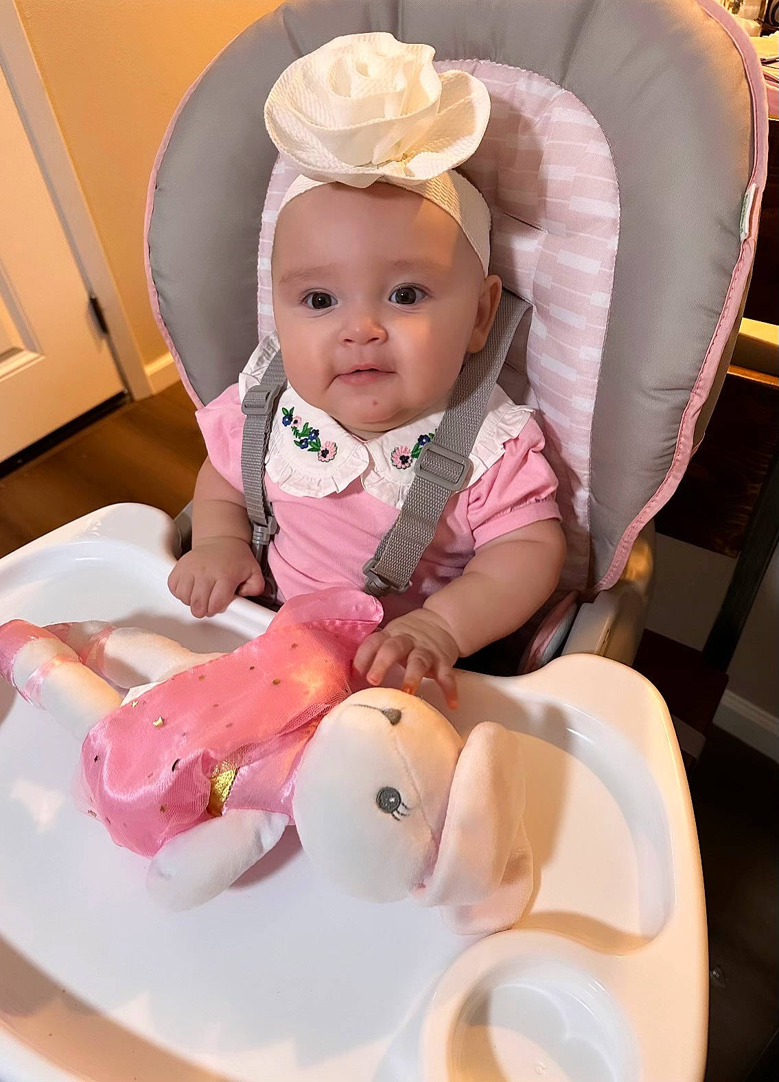 Jojo joined the competition — help win amazing prizes! baby, baby_products, baby_safety, baby_toddler_clothing, chair, cheek, child, comfort, drinkware, fashion_accessory, fun, happy, mammal, person, pink, room, sitting, skin, sleeve, toddler