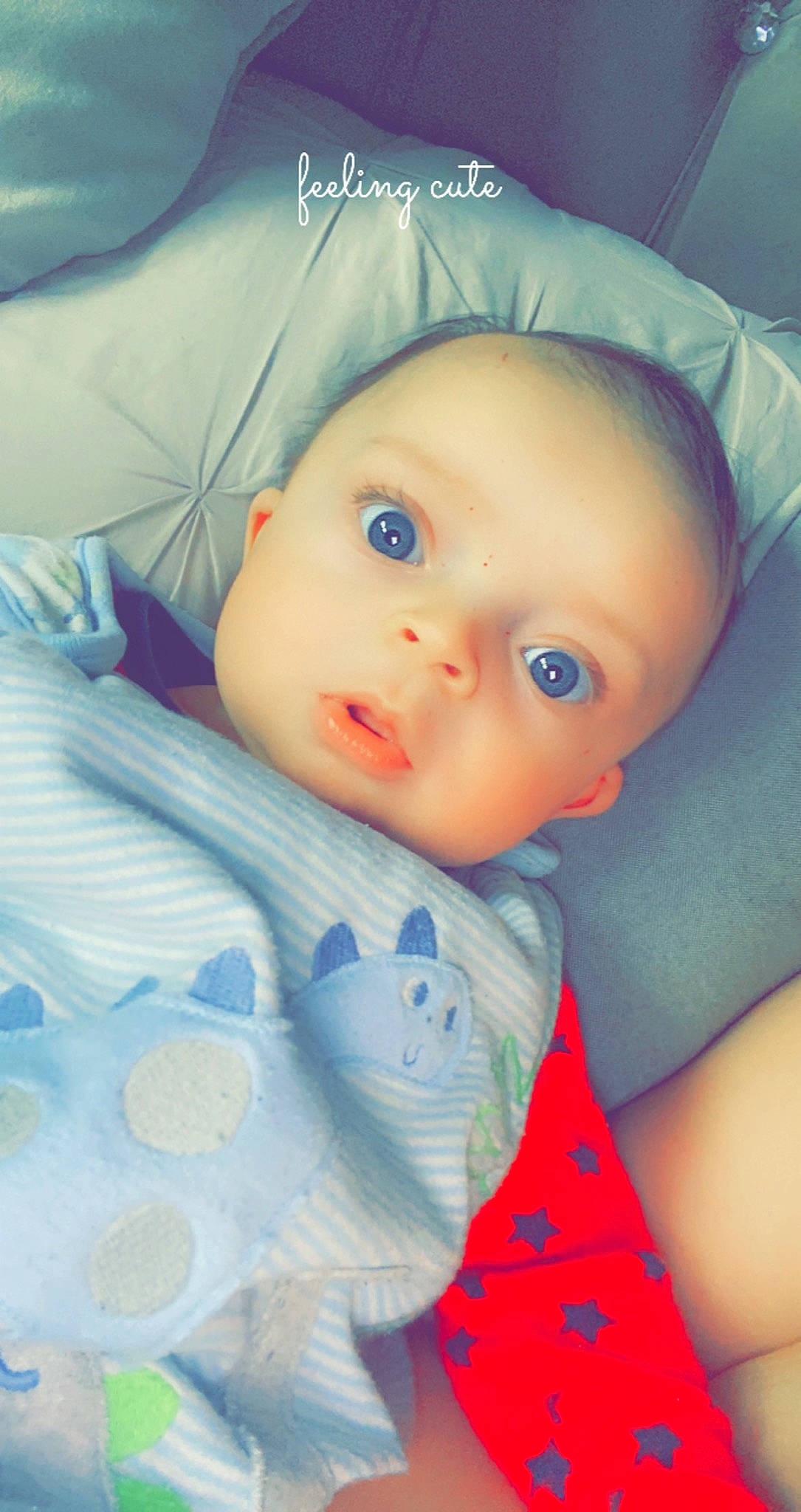 Neco is registered to the contest to win money with this photo: azure, baby, baby_toddler_clothing, cheek, child, chin, comfort, electric_blue, eyebrow, eyelash, facial_expression, happy, hat, iris, lip, nose, person, skin, sleeve, textile