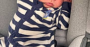 Elijah joined the competition — help win amazing prizes! baby, car_seat, child, clothing, cream, eyes, face, indoor, infant, navy_blue, newborn, padding, photography, portrait, relaxed, safety_label, sitting, sleepy, striped_outfit, vehicle