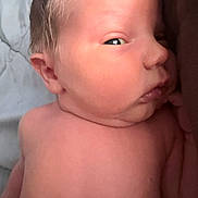 Elijah is registered to the contest to win money with this photo: newborn, baby, infant, portrait, face, head, eye, nose, ear, skin, sleepy, side_profile, bare_shoulders, close_up, bedding, blanket, indoor, resting, photography, person