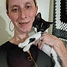 Oreo joined the competition — help win amazing prizes! animal, black_and_white_cat, casual_clothing, close_up, crocheted_blanket, cute, domestic, face, freckles, hand, happy, holding, hoop_earrings, indoor, kitten, person, pet, portrait, smiling, woman