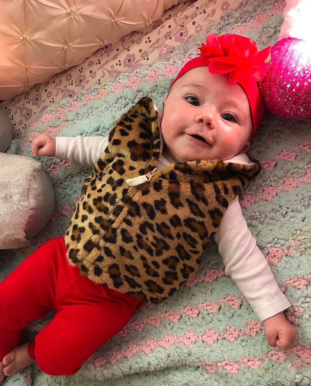 Avery is registered to the contest to win money with this photo: baby, baby_toddler_clothing, beanie, child, design, ear, fawn, felidae, fur, head, headgear, pattern, person, pink, play, skin, toddler