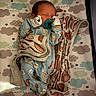 baby, newborn, sleeping, pacifier, blanket, pajamas, crib, mattress, cloud_pattern, stars, cozy, infant, child, sleep, cute, bedtime, soft_lighting, indoors, peaceful, wrapped