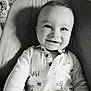 baby, child, smiling, portrait, black_and_white, seated, cushion, clothing, cute, face, happy, indoor, infant, person, shirt, small_child, young, baby_chair, expression, closeup