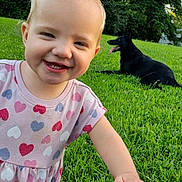 Jade joined the competition — help win amazing prizes! black_dog, child, dog, dress, grass, greenery, hand, happy, hearts, jeans, nature, outdoor, person, pet, playful, smiling, summer, sunlight, toddler, trees