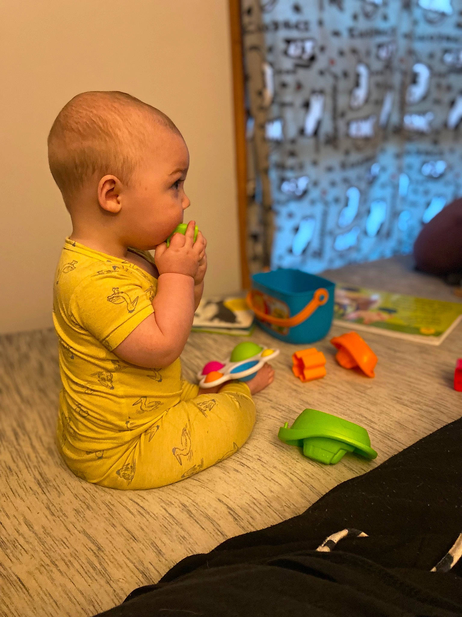 Judah is registered to the contest to win money with this photo: adaptation, baby, baby_toddler_clothing, child, comfort, finger, floor, flooring, foot, fun, hardwood, leisure, people, person, play, room, sitting, toddler, visual_arts, wood