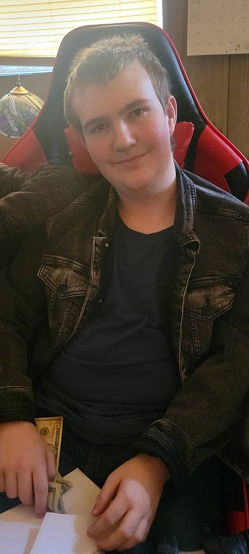 Christian is registered to the contest to win money with this photo: automotive_design, automotive_exterior, automotive_lighting, chest, cool, eyewear, family_car, flash_photography, forehead, fun, joy, luxury_vehicle, motor_vehicle, mouth, outerwear, person, sitting, sleeve, t_shirt, thigh