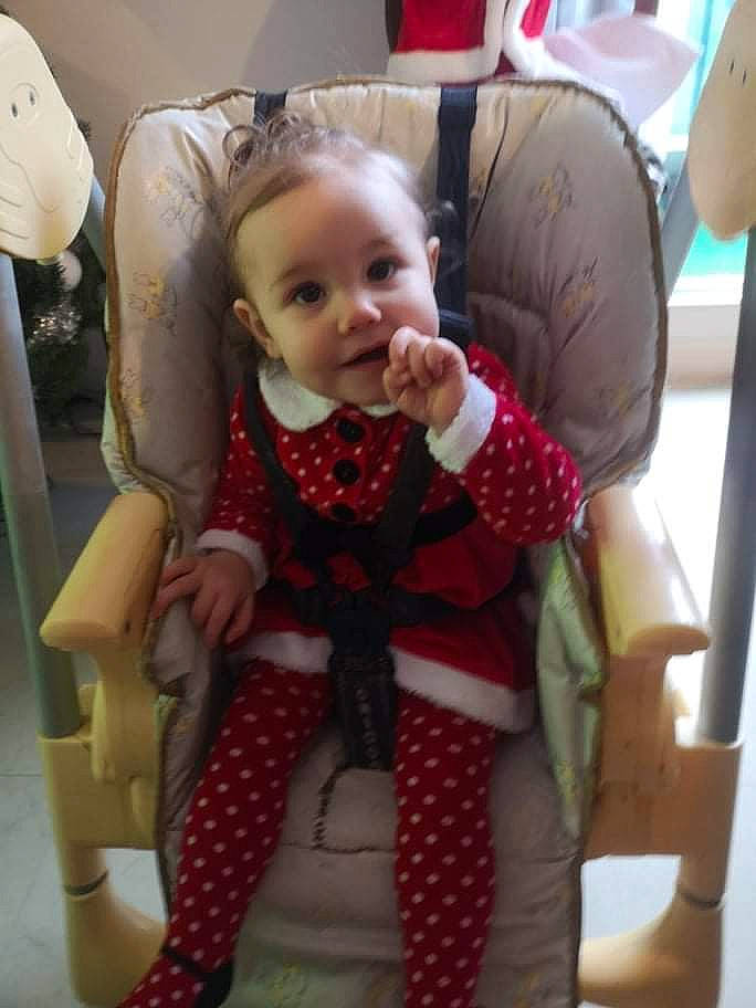 Les Jumelles Giulia Et Ilona participe au concours pour gagner de l'argent avec cette photo : arm, baby, baby_toddler_clothing, chair, cheek, comfort, eye, face, hand, head, human_body, iris, lap, mouth, person, skin, sleeve, smile, thigh, toddler