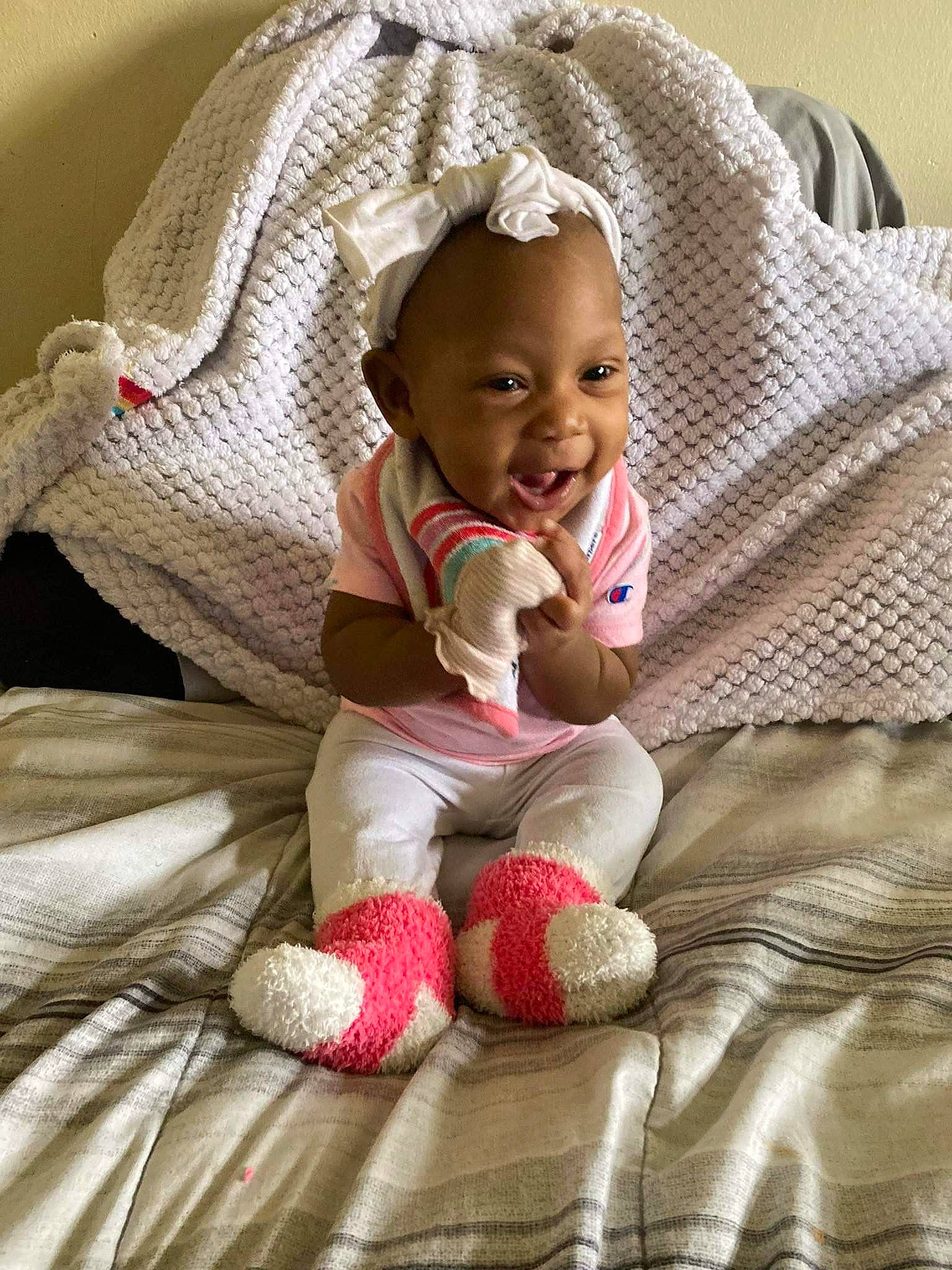 Samiyah is registered to the contest to win money with this photo: baby, baby_carriage, baby_products, baby_safety, baby_sleeping, baby_toddler_clothing, cheek, child, comfort, eye, flooring, hand, linens, mammal, person, product, sitting, skin, smile, textile