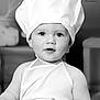 Zao a rejoint le concours — aidez-le/la à gagner de superbes lots ! apron, baby, black_and_white, bread, chef_hat, child, cooking, costume, cute, expression, face, food, hands, indoors, infant, kitchen, person, portrait, soft_light, young