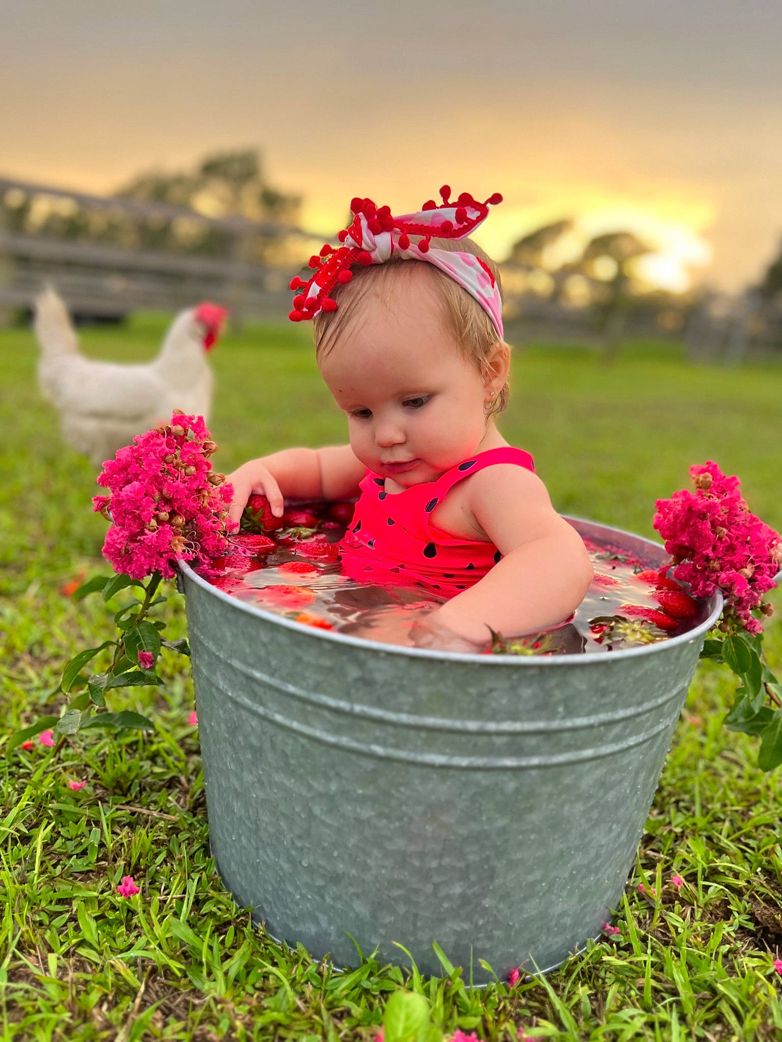 Emilia joined the competition — help win amazing prizes! baby, baby_toddler_clothing, child, face, fashion_accessory, flower, flowerpot, fun, grass, happy, magenta, people_in_nature, person, petal, pink, plant, sitting, sky, spring, toddler