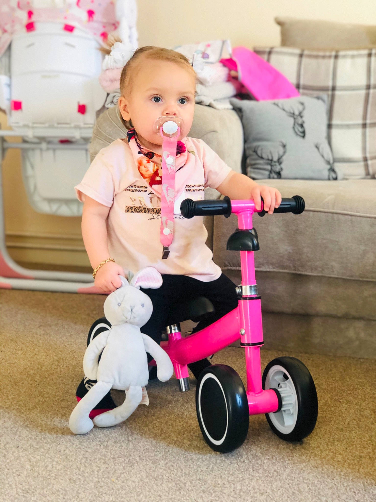 Kendal is registered to the contest to win money with this photo: baby_products, child, person, pink, product, riding_toy, toddler, tricycle, vehicle
