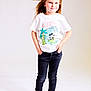 child, girl, smile, standing, white_tshirt, black_jeans, sandals, long_hair, studio, posing, fashion, casual, portrait, hands_in_pockets, happy, footwear, young, cute, blond, isolated