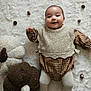Lyianna participe au concours pour gagner de l'argent avec cette photo : baby, infant, smiling, plush_toy, pumpkin, knitted_clothing, brown_clothing, white_rug, chestnut, soft_texture, cute, lying_down, child, autumn_theme, cozy, happy, indoors, portrait, baby_clothes, decor