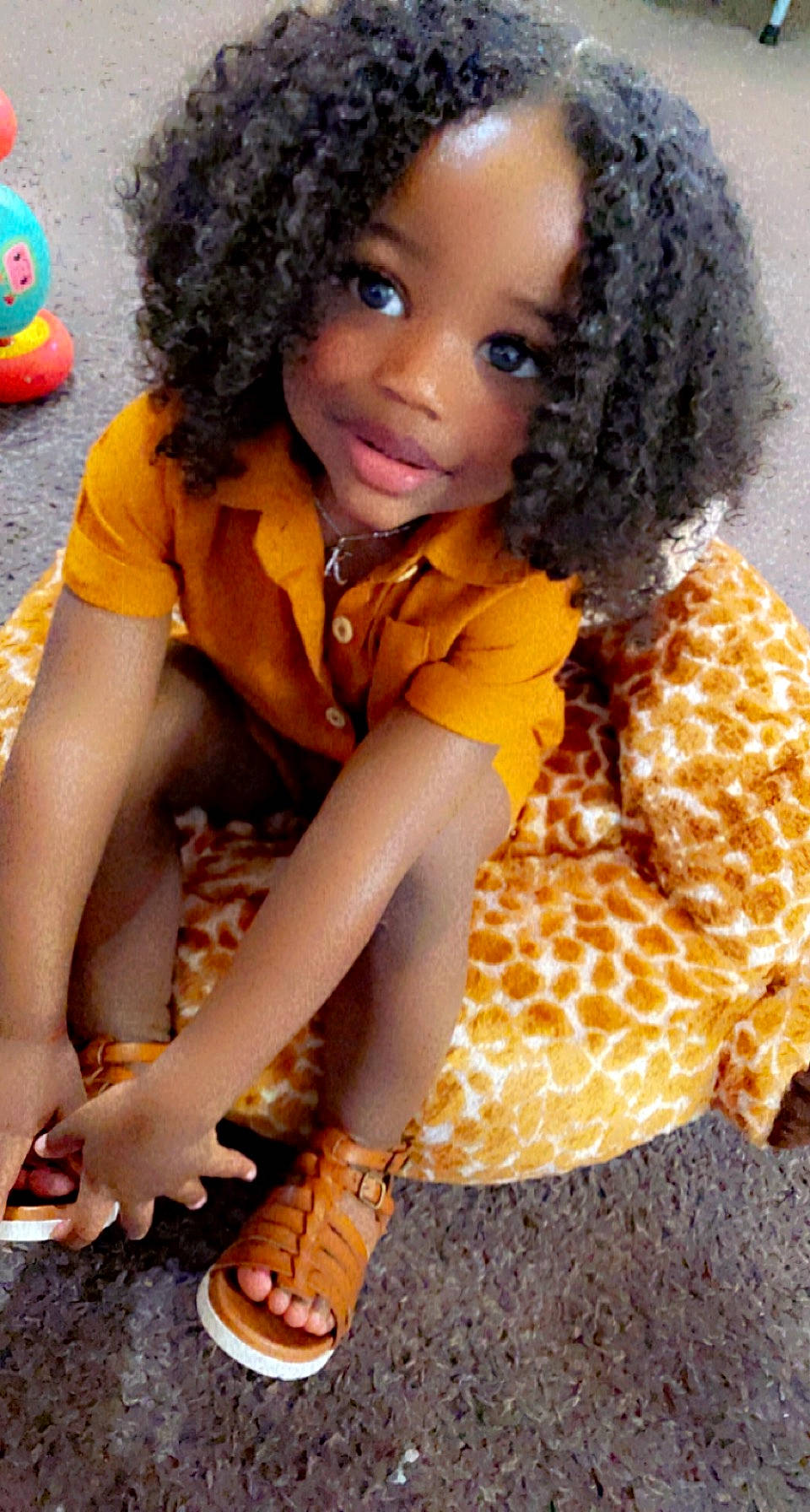 Khloe joined the competition — help win amazing prizes! adaptation, afro, arm, black, black_hair, fun, hair, hairstyle, head, human, jheri_curl, leg, mammal, orange, organ, person, skin, sleeve, thigh, toddler