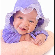 Iris joined the competition — help win amazing prizes! baby, purple_bonnet, smiling, happy, pillow, soft, cute, infant, child, face, portrait, clothing, headwear, hands, skin, closeup, lying_down, innocent, adorable, studio