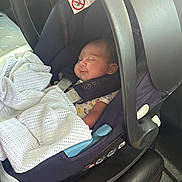Ellie Hazel is registered to the contest to win money with this photo: baby, car_seat, blanket, infant, sleeping, child, safety_harness, vehicle_interior, seat, cozy, peaceful, portrait, child_seat, car, newborn, clothing, soft_light, resting, cute, travel