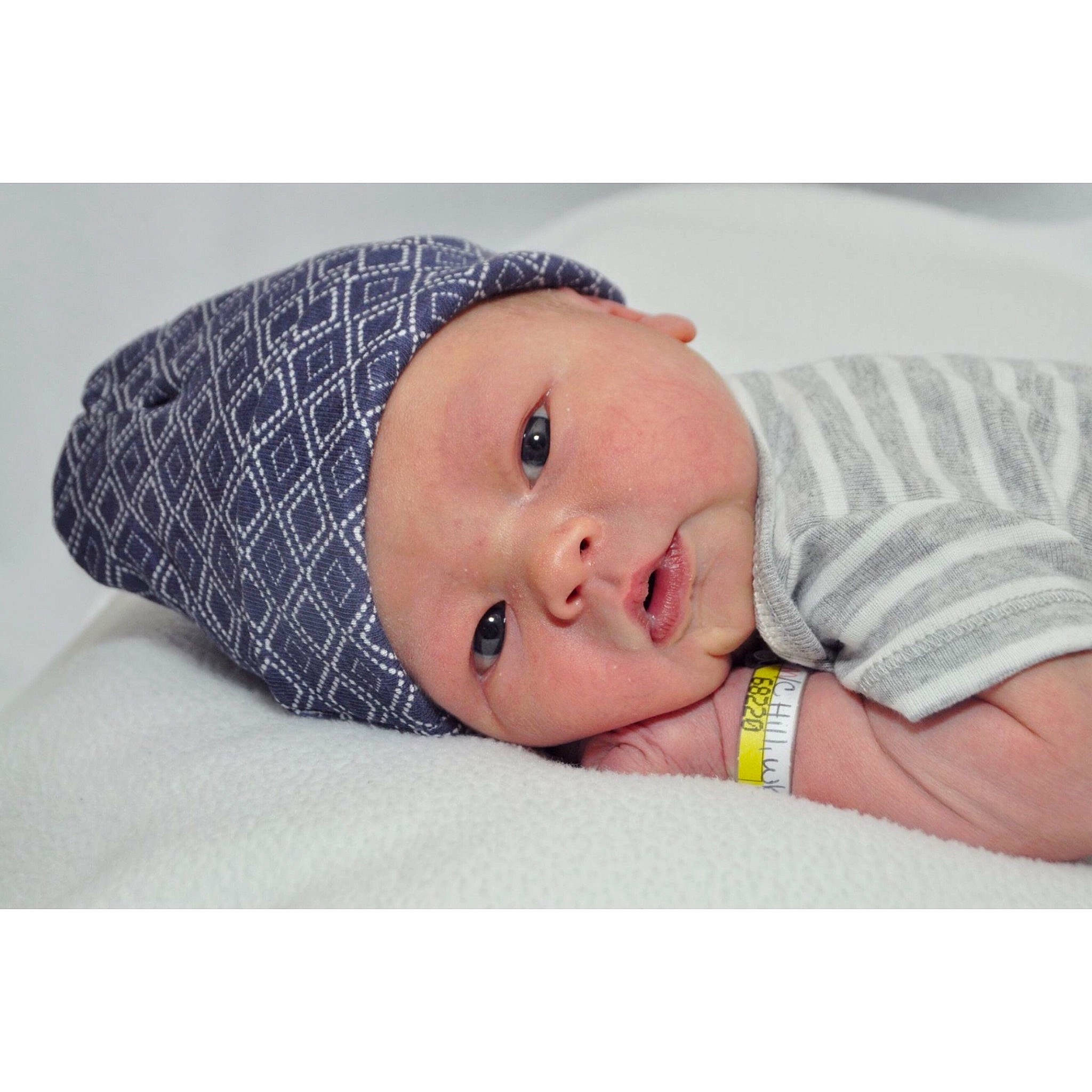 Shaun is registered to the contest to win money with this photo: baby, baby_sleeping, beanie, beige, bonnet, cap, child, fashion_accessory, head, headgear, person, photograph, photography, portrait_photography, product, textile, toddler, yellow