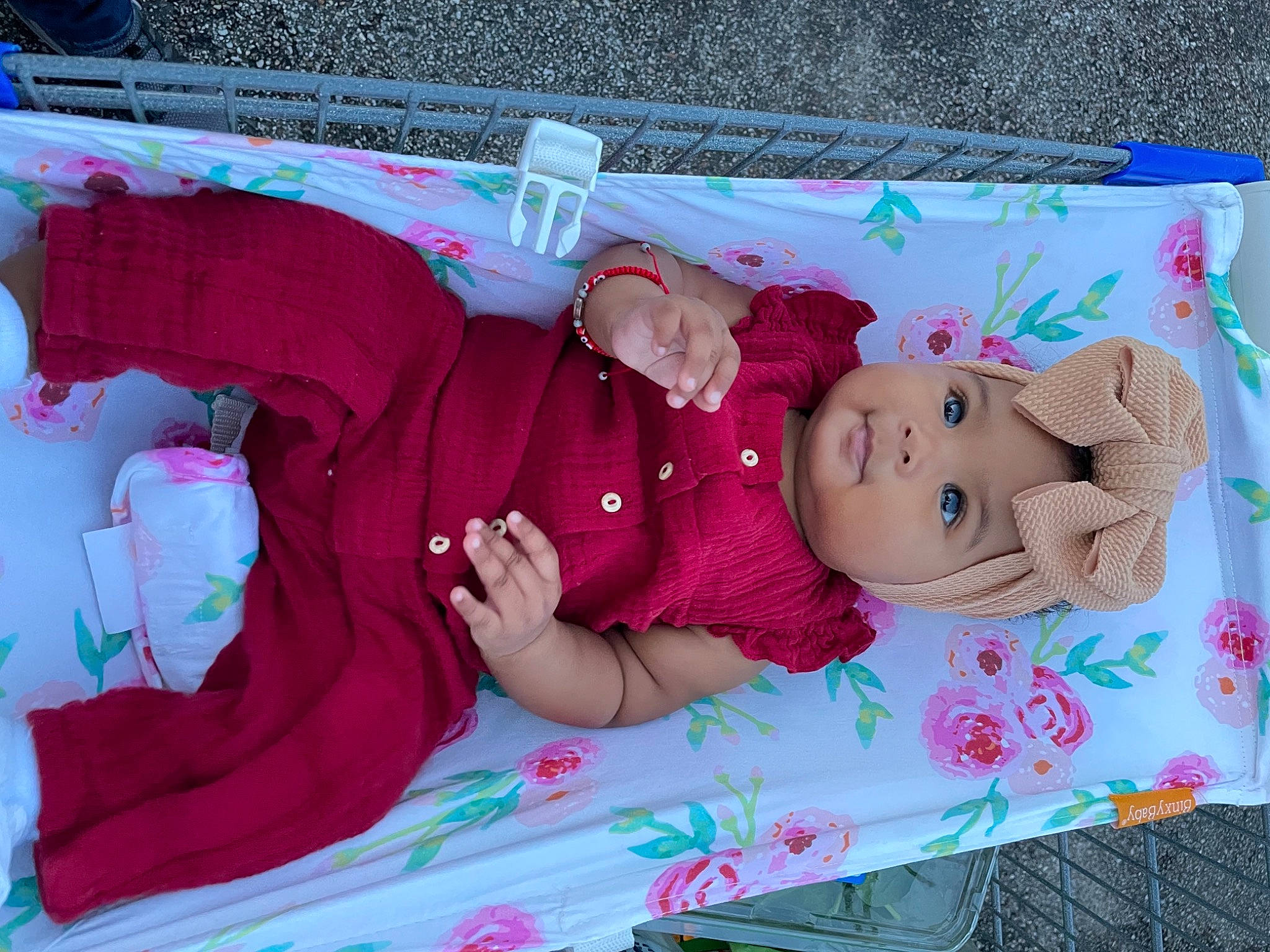 Emarie is registered to the contest to win money with this photo: baby, baby_products, baby_toddler_clothing, child, comfort, doll, event, grass, happy, headwear, lap, linens, magenta, nap, pattern, person, pink, room, sleep, toddler