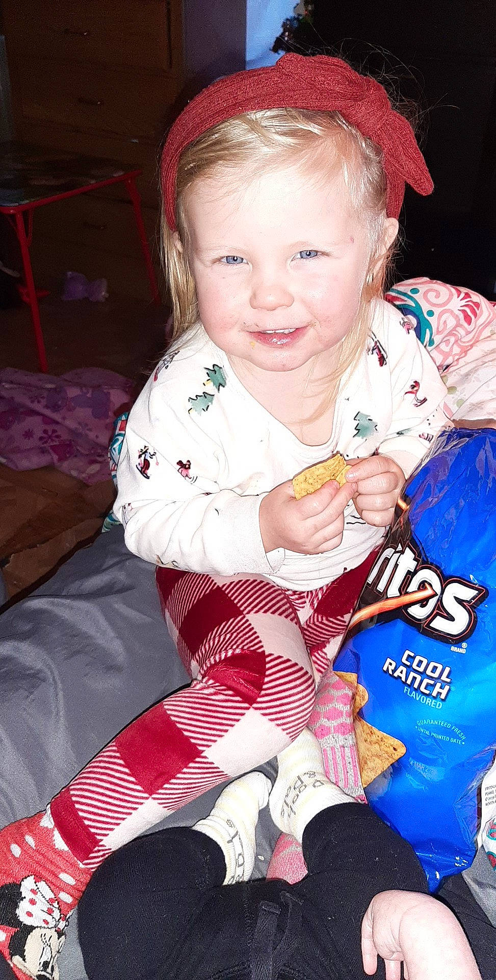 Mackenna is registered to the contest to win money with this photo: baby_toddler_clothing, cheek, child, christmas, event, eye, face, facial_expression, fun, hairstyle, happy, holiday, joy, lap, person, pink, red, skin, sleeve, smile