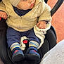 baby, beanie_hat, blanket, buckle, car_seat, cheeks, child, cute, eyes, face, floor_tiles, fluffy_jacket, hand, infant, knit_hat, looking_away, portrait, shoes, socks, stroller