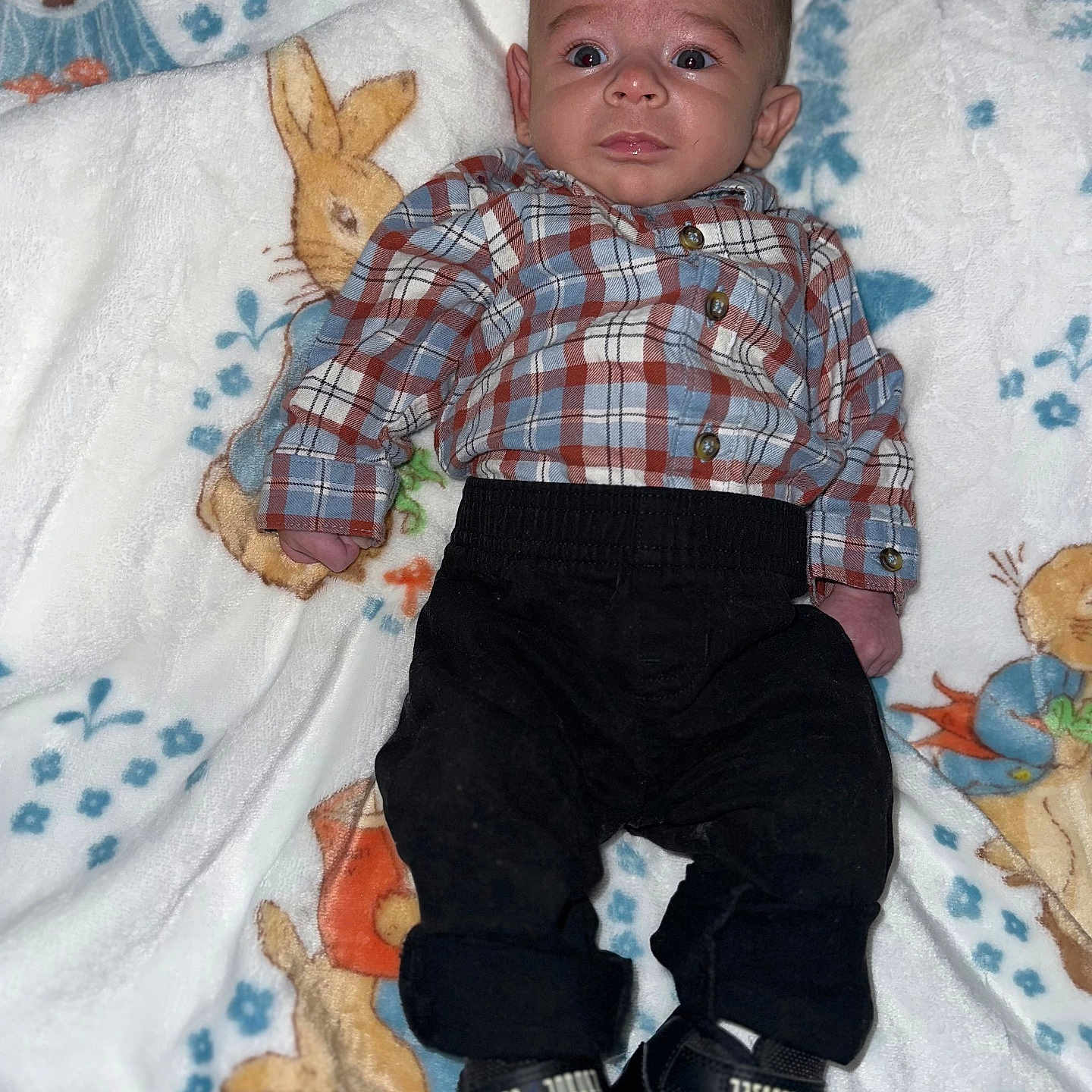 Karlito is registered to the contest to win money with this photo: baby, bed, bedroom, clothing, couch, face, footwear, furniture, head, homedecor, indoors, jeans, pants, person, photography, portrait, room, shirt, shoe, sitting