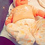 baby, infant, headband, bow, pajamas, floral_pattern, blanket, towel, soft_texture, lying_down, indoors, sparkles, butterfly, cute, child, person, comfort, sleepwear, pastel_colors, cozy
