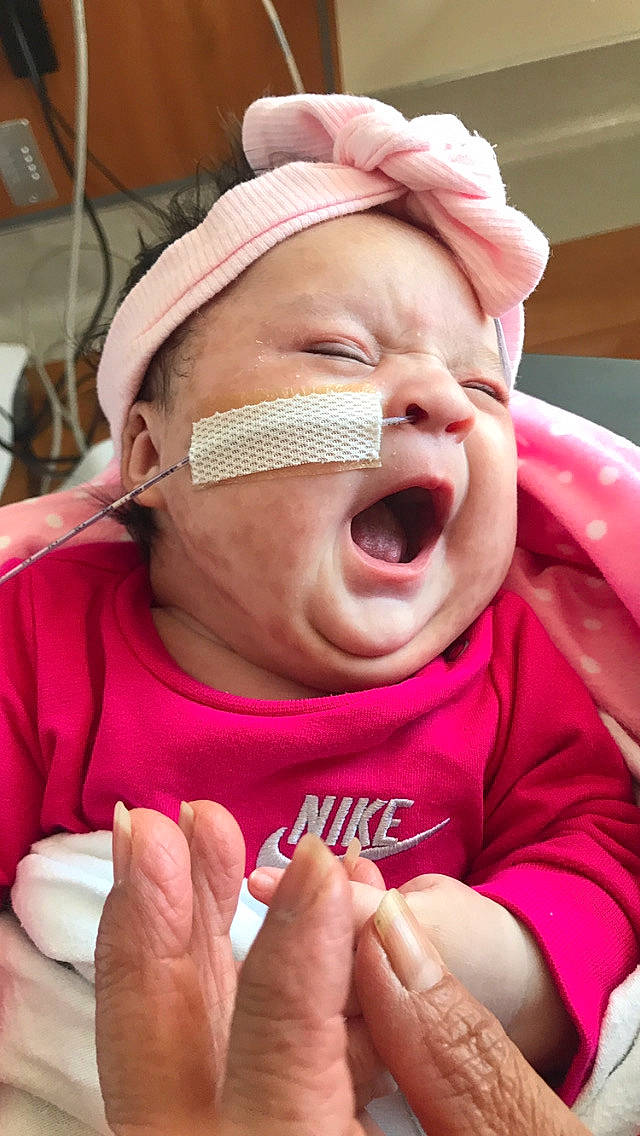 Gianna is registered to the contest to win money with this photo: baby, birth, cheek, child, childbirth, crying, face, facial_expression, laugh, mouth, nose, person, pink, skin, smile, toddler, wrinkle, yawn