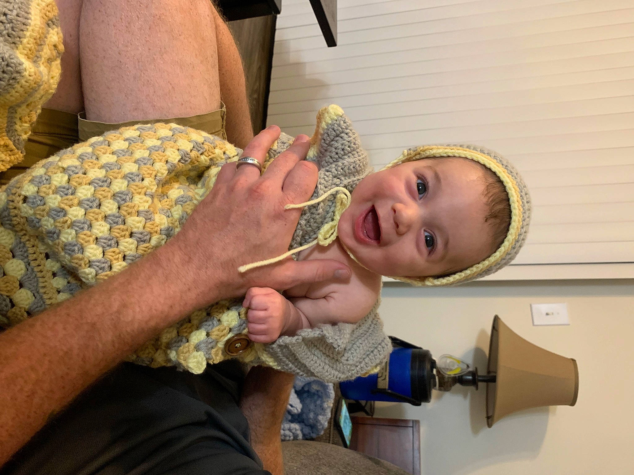 Andrew is registered to the contest to win money with this photo: arm, baby, child, comfort, event, fashion_accessory, finger, fun, gesture, hand, happy, jewellery, nail, pattern, person, room, smile, thumb, toddler, wood