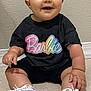 Sophia joined the competition — help win amazing prizes! baby, child, toddler, sitting, smiling, headband, pink_bow, barbie_tshirt, white_sneakers, floor_tiles, indoor, cute, happy, person, footwear, clothing, portrait, young_child, hand, face