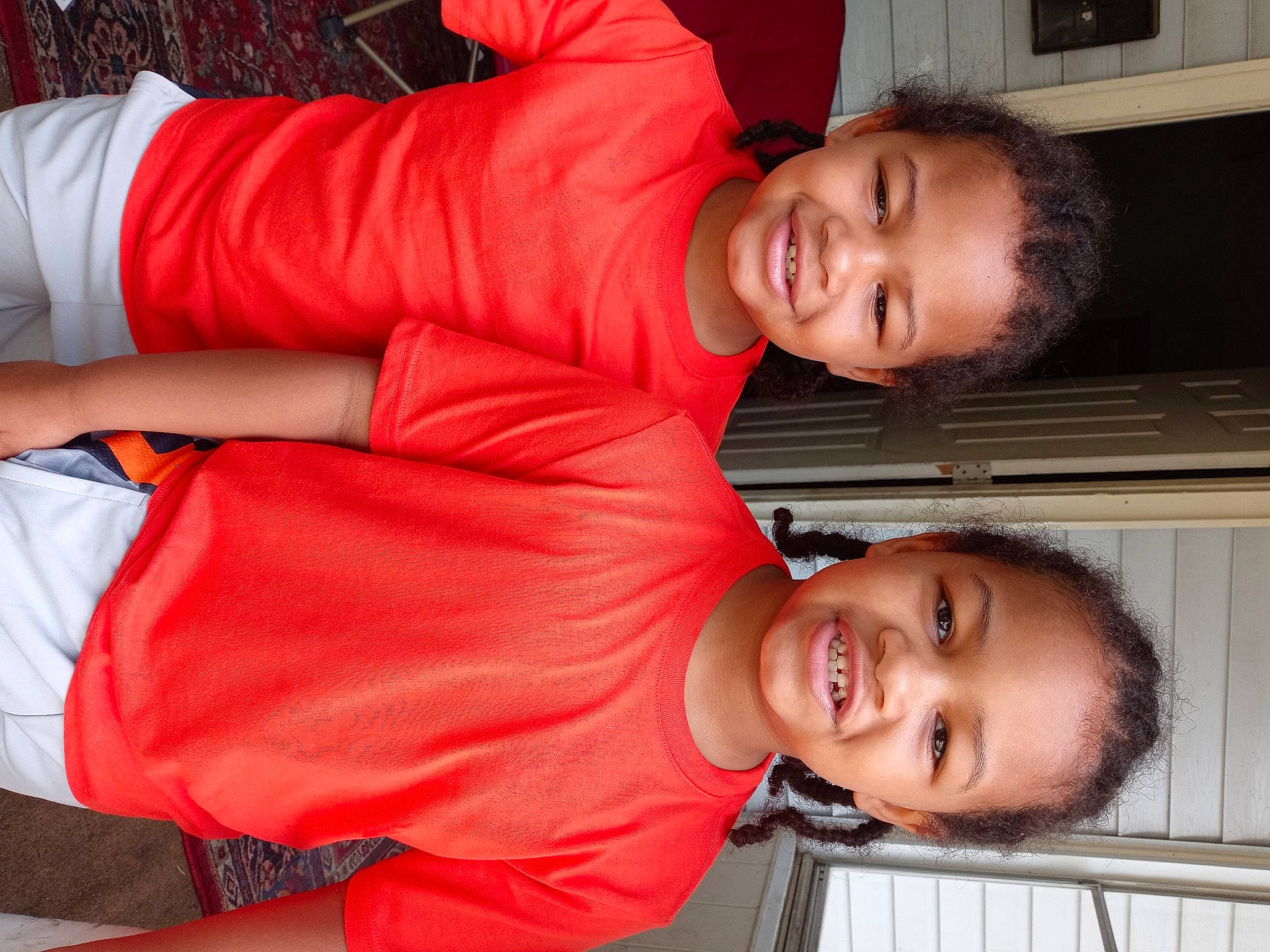 Rondell And Rockell is registered to the contest to win money with this photo: arm, comfort, elbow, eye, fun, gesture, happy, human_body, joint, joy, mouth, muscle, nose, orange, organ, person, red, shoulder, skin, sleeve