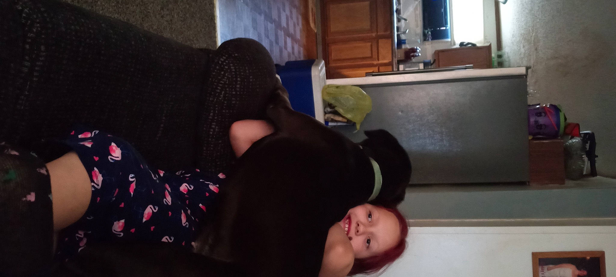 Annabella is registered to the contest to win money with this photo: baby, black, cabinetry, comfort, curtain, flooring, foot, fun, hardwood, human_leg, joy, knee, lap, living_room, nap, person, room, sitting, sock, thigh