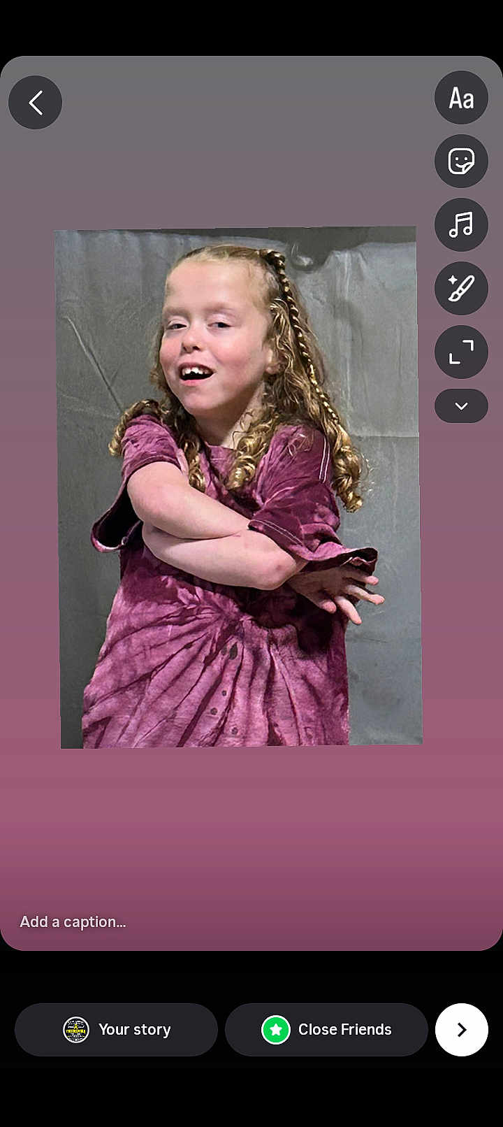 Aurora is registered to the contest to win money with this photo: child, person, curly_hair, purple_shirt, tie_dye, portrait, smiling, arms_crossed, standing, indoor, casual, young, cute, hair_braid, background, fun, happy, light_skin, expression, clothing