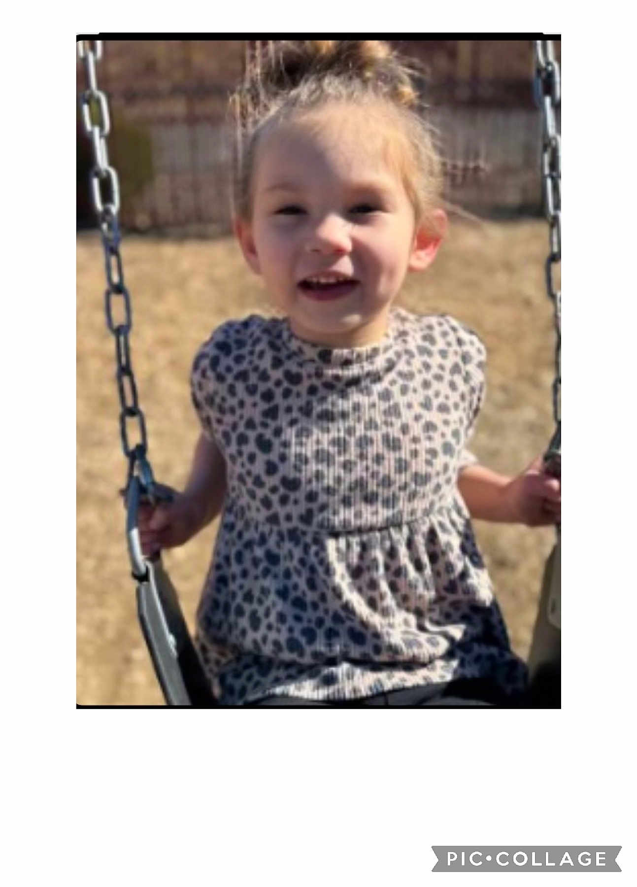 Iris is registered to the contest to win money with this photo: child, girl, swing, playground, outdoor, sunny, leopard_print, top, hair_bun, smiling, holding, metal_chains, seat, daylight, happy, young, person, casual, fun, park