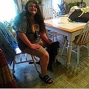 Missy Tang is registered to the contest to win money with this photo: beauty, black, chair, cool, eyewear, fashion_design, flooring, happy, human_leg, knee, leg, leisure, luggage_and_bags, metal, shoe, sitting, t_shirt, table, thigh, wood