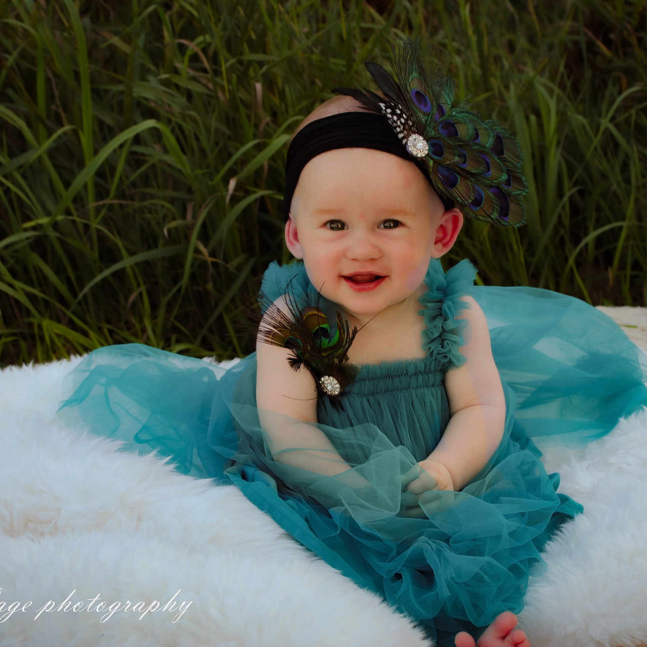Vivian joined the competition — help win amazing prizes! baby, blanket, child, cute, dress, fashion, fluffy, grass, happy, headband, nature, outdoor, peacock_feathers, person, photography, portrait, sitting, smiling, tutu, young