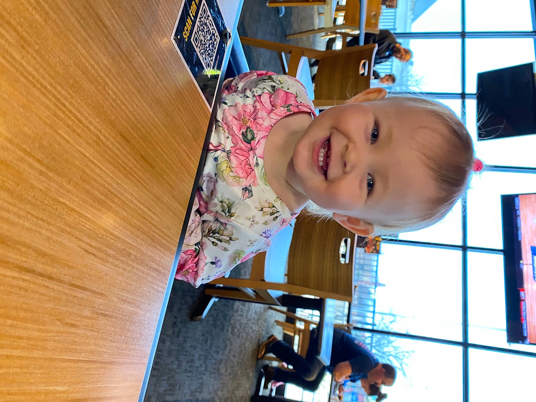 Alena is registered to the contest to win money with this photo: baby, baby_toddler_clothing, cheek, child, fun, happy, hardwood, joy, laugh, leisure, nose, person, play, recreation, room, smile, t_shirt, toddler, varnish, window