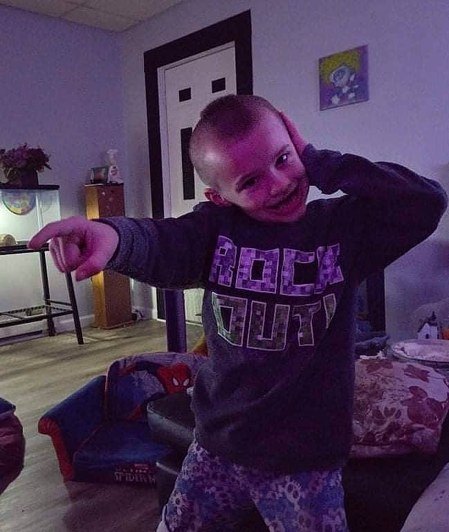 Dante joined the competition — help win amazing prizes! child, cool, flooring, fun, fur, happy, houseplant, joy, long_sleeved_t_shirt, magenta, person, picture_frame, pink, purple, selfie, sitting, sleeve, smile, sportswear, t_shirt