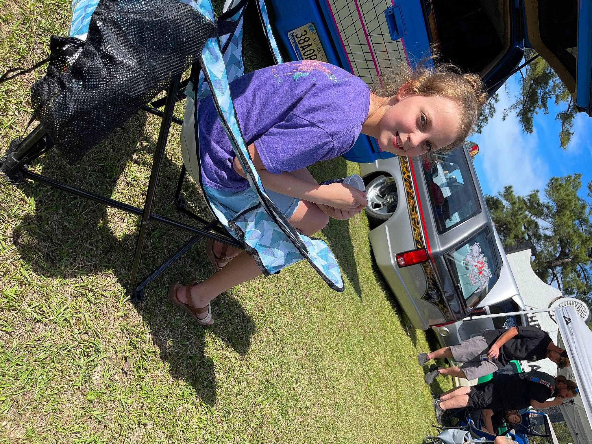 Madalin is registered to the contest to win money with this photo: automotive_exterior, bumper, car, child, city, family_car, fun, grass, joy, leisure, motor_vehicle, outdoor_play_equipment, person, plant, play, recreation, sky, tire, toddler, tree